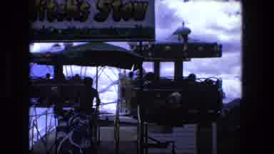 Fort Wayne Indiana (1976): People Riding Twisting And Turning Amusement Park Ride