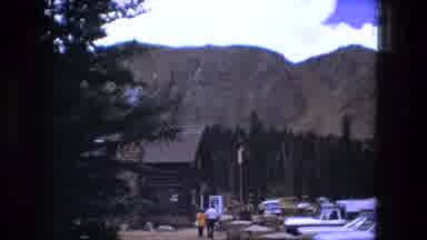 Fort Wayne Indiana (1976): Parking Lot Near Mountain With People And Old Cars
