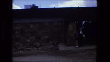 Fort Wayne Indiana (1976): A Child And An Adult In Front Of An Establishment