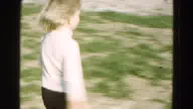 Diller Nebraska-1968: A Little Girl Picks Up A White Kitten And Runs Through The Grass