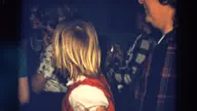 Diller Nebraska (1968): Child Wiping His Nose With Her Hand While Watching