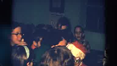 Diller Nebraska (1968): Grandmother Kisses Santa Clause At A Christmas Party With