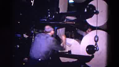 Trenton New Jersey (1967): Man Wearing Blue Shirt With Glasses Removes Empty Paper