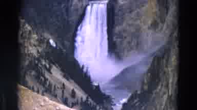 Yellowstone Park Wyoming (1967): Waterfall Cascades Down Into Valley Among