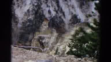 Yellowstone Park Wyoming (1967): Melting Mountain Snow And Trees On A Sunny Day