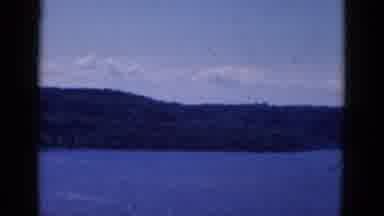 Albany Ney York (1968): A Large Boy Of Water Is Surrounded By Mountains On Its