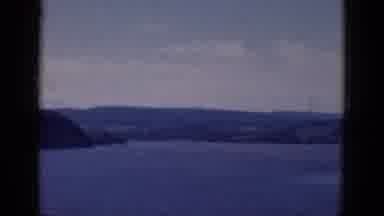 Albany Ney York (1968): Camera Pans Over A Lark Beautiful Lake With And Island In