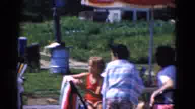 Albany Ney York (1968): A Group Of People Outdoors Playing Near A Lake Pool Or