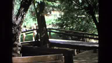 Fort Wayne Indiana (1976): Brown Wooden Bridge And Brown Car Parked At Small Shop