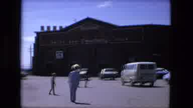 Fort Wayne Indiana (1976): A Large Brown Store Surrounded By Several Cars With