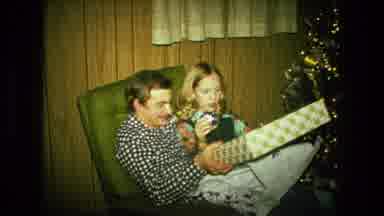 Fort Wayne Indiana (1976): People Opening Christmas Presents In Living Room With