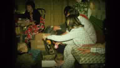 Fort Wayne Indiana (1976): Woman Wearing Black Shirt Helps People Sorting Out