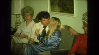 Fort Wayne Indiana (1976): Couple Kiss At Christmas Party Then Shows Man Looking