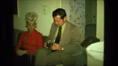 Fort Wayne Indiana (1976): A Blonde Lady Sitting Next To A Man With A Camera