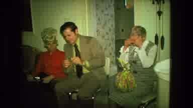 Fort Wayne Indiana (1976): Older Adults Sitting In A Family Room With A Woman
