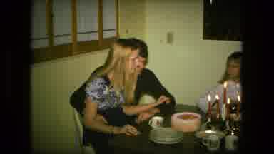 Fort Wayne Indiana (1976): A Woman Sits In A Man's Lap At A Table And Celebrates