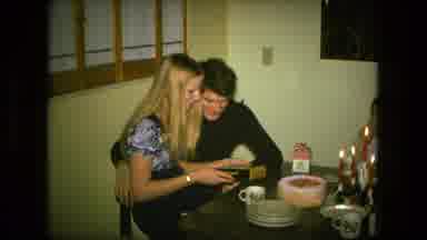 Fort Wayne Indiana (1976): Woman Sitting On A Man's Lap At A Table Opening Gifts
