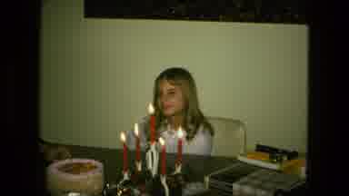 Fort Wayne Indiana (1976): Blonde Girl Sitting Behind Candles Sticks Her Tongue