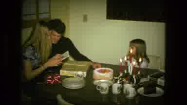 Fort Wayne Indiana (1976): Young Family Gathered At Dining Table Watching Parents