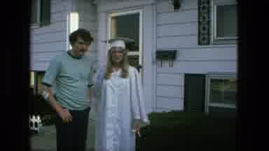 Fort Wayne Indiana (1976): Young Man In Graduation Outfit Poses With Man Beside