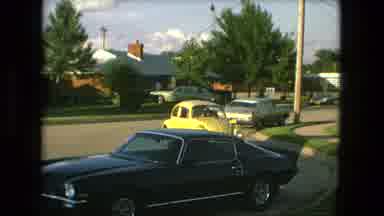 Fort Wayne Indiana (1976): A Yellow Beetle Car Moving Around In Parking In A