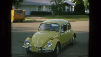 Fort Wayne Indiana (1976): A Green Volkswagen Bug Pulling Out Of A Driveway Of A