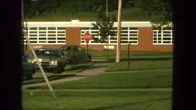Fort Wayne Indiana (1976): Car Leaving Then Woman Looking At Flowers On The Side