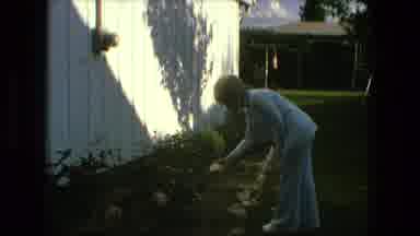 Fort Wayne Indiana (1976): Women And Child Admiring Flower Garden By Side Of House