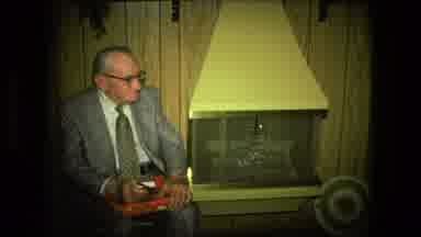 Fort Wayne Indiana (1976): Older Man In Suit Sitting On Chair Between Fireplace
