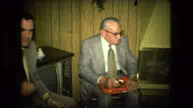 Fort Wayne Indiana (1976): Men Inside Sitting Around By The Fire Looking Around At
