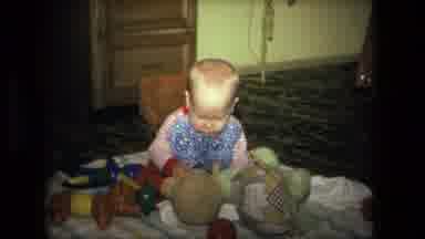 Fort Wayne Indiana (1976): Kid Baby Playing With A Toy Finding Out What To Do With