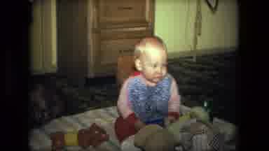 Fort Wayne Indiana (1976): Baby On Floor Surrounded By Toys Looking Across The