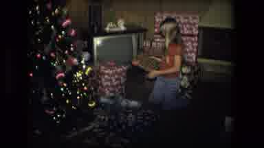 Fort Wayne Indiana (1976): Young Girl Reading Names On Packages By The Christmas