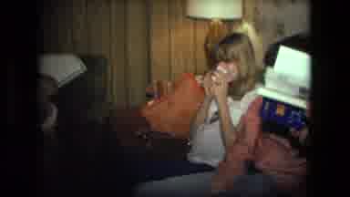 Fort Wayne Indiana (1976): A Man Is Reading A Book And Other People Are Resting On