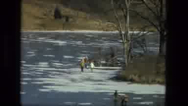 Fort Wayne Indiana (1976): Family Walks Their Dog On A Frozen River Bank In A