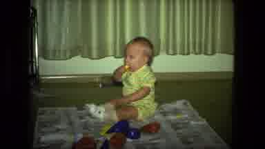 Fort Wayne Indiana (1976): Baby In A Yellow Outfit Sitting On A Blanket And