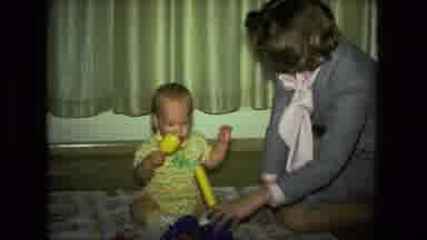 Fort Wayne Indiana (1976): A Mother Playing With A Small Baby And Teaching Them