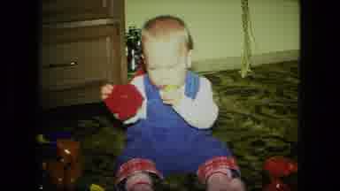 Fort Wayne Indiana (1976): Baby Playing With Toys Chewing On Yellow Toy Kicking