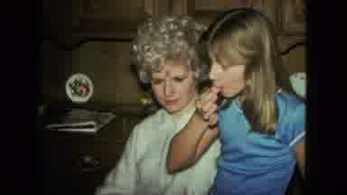 Fort Wayne Indiana (1976): Girl Using Finger To Try Frosting While Sitting With