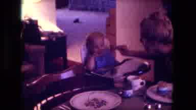 Fort Wayne Indiana (1976): Mother Feeds A Baby Slowly From A Cup With Two Plates