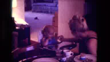 Fort Wayne Indiana (1976): Baby In A High Chair Being Feed Food By A Woman