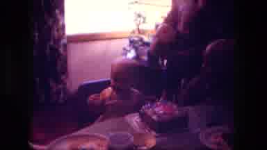 Fort Wayne Indiana (1976): A Baby And Kid Are Sitting On Dining Table To Celebrate