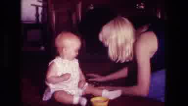 Fort Wayne Indiana (1976): Mother Picking Up Baby's Food