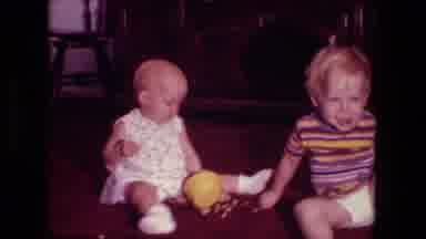 Fort Wayne Indiana (1976): Two Young Children Sit Next To Each Other Then Abruptly