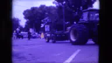 Fort Wayne Indiana (1976): A Tractor Coming Down The Street With Lots Of People