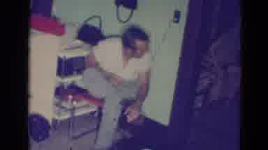 Minnesota (1976): Man Wearing White Shirt Watches Girl Wearing Grey Shirt Walk Out