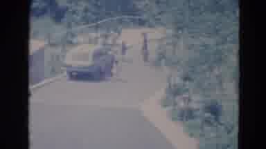 Minnesota (1976): Two Kids Run Past White Car On A Bright Sunny Day