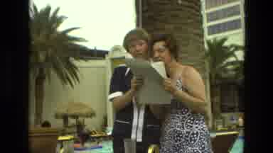 Las Vegas (1978): Man And Woman Reading A Paper On A Summer Day Is A Contrast