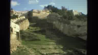 Granada Spain (1978): The Rock Face Of A Cliff Intersects With Some Old Stone