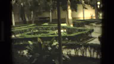 Cordoba Spain (1978): A Fountain In Middle Of A Garden That Is In Front Of A